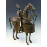 A LATE 19th C. LACDJUR, SENEGAL BRASS HORSE AND RIDER, THE HORSE ELABORATELY CAPARISONNED, THE RIDER