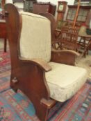 AN INTERESTING EARLY 20th C. OAK ARTS AND CRAFTS DESIGN ARMCHAIR. H 104. W 68cms