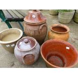 TWO TERRACOTTA LIDDED OIL JARS, PLANTERS ETC