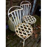 A PAIR OF FRENCH PAINTED WROUGHT IRON PATIO CHAIRS