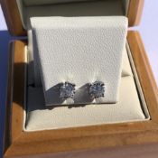 A PAIR OF DIAMOND STUD EARRINGS. APPROX DIAMOND WEIGHT 0.65cts. UNHALLMARKED, ASSESSED AS 9ct