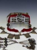 VINTAGE TRIBAL JEWELLERY TO INCLUDE A PRAYER BOX NECKLACE, AN ORNATE CHOKER, A MULTI STRAND RED