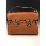 A BROWN LANCEL HANDBAG COMPLETE WITH A FLAP MAKE UP MIRROR AND DUST BAG .H 30 x W 37 cms.