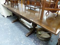 A 20th C. OAK DRAW LEAF REFECTORY TABLE ON CUP AND COVER LEGS EACH NARROW END WITH AN H-SHAPED