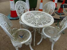 A SMALL PAINTED PATIO TABLE AND FOUR CHAIRS