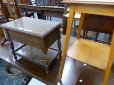 AN OAK COFFER TOPPED SEWING TABLE TOGETHER WITH AN OAK TWO TIER WINE TABLE