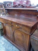 A VICTORIAN MAHOGANY CREDENZA SIDEBOARD WITH FOLIAGE CRESTING THE SHELF BACK A DRAWER TO THE BASE