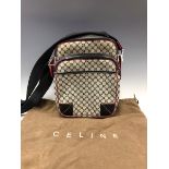 A CROSS BODY CELINE BAG WITH ADJUSTABLE STRAP. W 20 x H 26 cms.