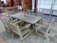 A TEAK GARDEN TABLE AND SIX CHAIRS BY BURROW TYRIE.