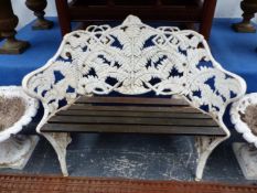 A COALBROOKDALE CAST IRON FERN PATTERN GARDEN BENCH WITH SLATTED WOODEN SEAT. W 112cms.