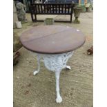 A VINTAGE PUB TABLE ON PAINTED CAST IRON BASE