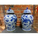 A PAIR OF ORIENTAL BLUE AND WHITE DRAGON DECORATED COVERED BALUSTER VASES SIX CHARACTER MARK