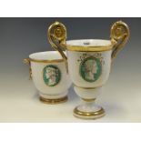 A 20th C. ITALIAN TIN GLAZED POTTERY TWO GILT HANDLED CUP PAINTED WITH A GRISAILLE ROMAN HEAD ON A