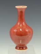 A CHINESE PEACH BLOOM BALUSTER VASE, SIX CHARACTER MARK IN BLUE. H 16.5cms.