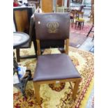 A LATE VICTORIAN OAK PUGINESQUE CHAIR TOGETHER WITH A LATER IRON FIRE SCREEN (2)