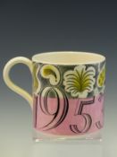 A 1953 WEDGWOOD ELIZABETH II CORONATION MUG DESIGNED BY ERIC RAVILIOUS