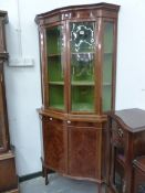 AN EARLY 20th C. LINE INLAID MAHOGANY CORNER CUPBOARD, THE UPPER HALF GLAZED AND RECESSED ABOVE