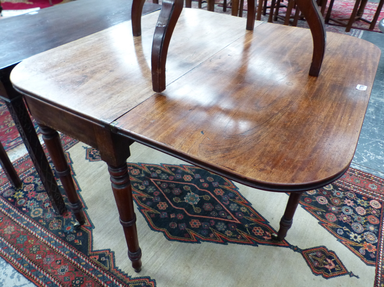 A 19th C. MAHOGANY TEA TABLE. THE ROUNDED RECTANGULAR TOP OPENING ON A SINGLE GATE, THE RING - Image 4 of 4