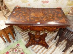 A 19th C. DUTCH MARQUETRIED MAHOGANY GAMES TABLE SWIVEL OPENING ONTO A CIRCLE OF BAIZE WITH CARD