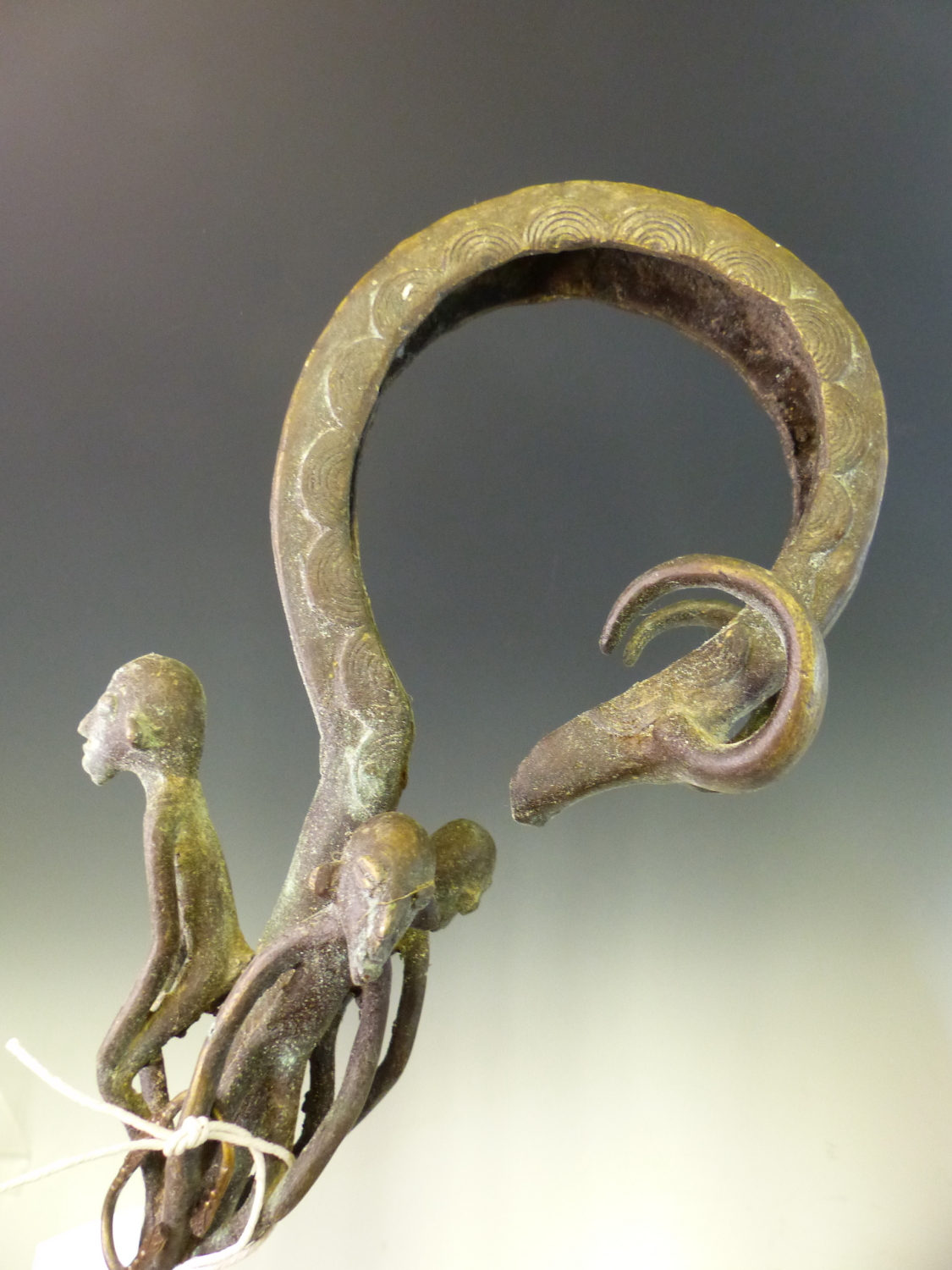 A 20th C. ASANTE BRONZE STAFF OF OFFICE, THE HOOKED HANDLE ENDING IN THE HEAD OF A GAZELLE ABOVE