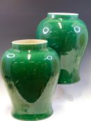 A PAIR OF CHINESE BALUSTER JARS EVENLY COVERED IN A FINELY CRACKLED GREEN GLAZE, SIX AND FOUR