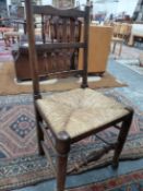 A SET OF FIVE 19th C. RUSH SEATED OAK CHAIRS, EACH WITH TWO BANDS OF SPINDLES TO THEIR BACKS, THE