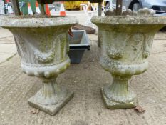 A PAIR OF COMPOSITE CLASSICAL STYLE GARDEN URNS