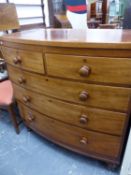 A 19th C. MAHOGANY BOW FRONT CHEST OF TWO SHORT AND THREE GRADED LONG DRAWERS ON TURNED LEGS. W