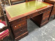 A GEORGIAN STYLE MAHOGANY TWO PEDESTAL DESK TOOLED INSET GREEN LEATHER TOP. THREE APRON DRAWERS