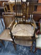A SMOKERS BOW CHAIR A RUSH SEATED ELBOW CHAIR AND ANOTHER CHAIR WITH CANED BACK AND SEAT