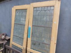 SIX MATCHING PAINTED ART DECO DOORS WITH INSET BRONZE FRAMED GLAZING FOR RESTORATION.