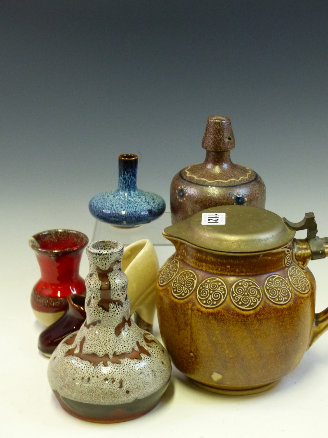 FOUR STUDIO POTTERY VASES, A SHOE AND A MERKELBACH BROWN STONE WARE JUG MOUNTED WITH A METAL LID