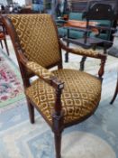 A 19th C. FRENCH WALNUT SHOW FRAME ARMCHAIR WITH SHELLS CARVED TO THE BACK ABOVE THE ARMS