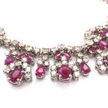 A RUBY AND DIAMOND COLLAR. THE NECKLACE CONSISTING OF OVAL, PEAR AND MARQUISE CUT RUBIES ON