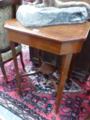 A EDWARDIAN OAK CANTED SQUARE TABLE ON TAPERING SQUARE SECTIONED LEGS JOINED BY STRETCHERS MEETING A