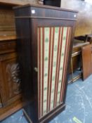 A ROSE WOOD CUPBOARD, THE TEXTILE INSET DOOR ENCLOSING SHELVES. W 49 x D 27 x H 124cms. AND A