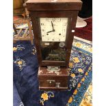 TWO NATIONAL TIME RECORDER CLOCKING IN CLOCKS IN STAINED WOOD CASES. H 98.5cms.
