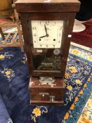 TWO NATIONAL TIME RECORDER CLOCKING IN CLOCKS IN STAINED WOOD CASES. H 98.5cms.