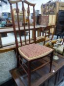 AN ART NOUVEAU MAHOGANY CHAIR THE BAR BACK PAINTED WITH THREE WHITE FLOWER ROUNDELS, THE STUFFED