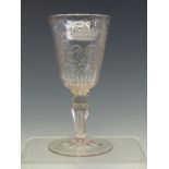 AN 18th C. BOHEMIAN WINE GLASS, THE BOWL ENGRAVED WITH A CROWNED MONOGRAM BETWEEN FRUITING LEAVES,