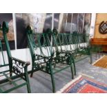 A PAINTED ARTS AND CRAFTS STYLE IRON BENCH WITH FOUR MATCHING ARM CHAIRS.