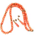A ROW OF CORAL BEADS INTERSPERSED WITH 9ct GOLD ROUNDLES, TOGETHER WITH A PAIR OF CORAL BOMB SHAPE