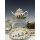 A CHINESE EXPORT FAMILLE ROSE PART TEA SET PAINTED WITH FIGURES AND TABLES, COMPRISING: A PLATE, A