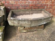 A BOWED STONE SINK. 108 x 63 x 21cms. VIEWING FOR THIS ITEM IS BY APPOINTMENT ONLY, AND IS NOT AT JS