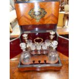 A 19th C. ROSEWOOD DECANTER BOX MARQUETRIED IN BRASS AND EBONY WITH FOLIATE ESCUTCHEONS, THE