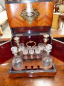 A 19th C. ROSEWOOD DECANTER BOX MARQUETRIED IN BRASS AND EBONY WITH FOLIATE ESCUTCHEONS, THE