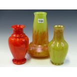 THREE EARLY 20th C. GLASS VASES AND A FROSTED VASELINE GLASS LIGHT SHADE, THE RED AND GILT VASES.