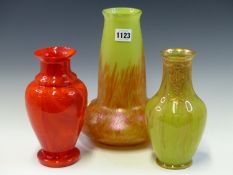 THREE EARLY 20th C. GLASS VASES AND A FROSTED VASELINE GLASS LIGHT SHADE, THE RED AND GILT VASES.