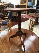 A 19th C. MAHOGANY TRIPOD TABLE, THE CIRCULAR TOP ON A GUN BARREL COLUMN AND RECTANGULAR SECTIONED