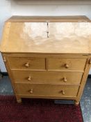 A ROBERT MOUSEMAN THOMPSON OAK BUREAU, THE FALL ABOVE TWO SHORT AND TWO LONG DRAWERS. W 76 x D 48